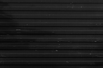 Black corrugate wall background and texture, old and weathered metal sheet gray color background, metal texture surface or galvanize steel.