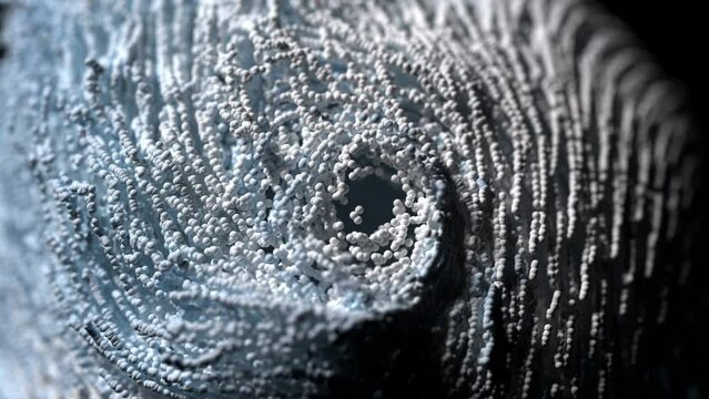 3d render of abstract art video animation of surreal twisted swirl rotating substance as funnel based on small balls spheres particles in blue and white mix color with depth of field effect