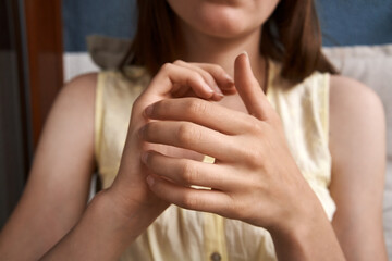 Teenage girl tapping on the side of the hand - practicing EFT or Emotional Freedom Technique
