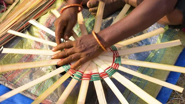 A artist doing her work to sale handicraft items at handicraft fair. Selective focus.