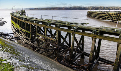 Entrance to the old Sharpness Docks with washed up debris from storms, GLoucestershire, United Kingdom