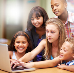 Young tutor, laptop and teaching children. kids or pupils technology, social media or research in...