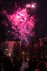 Capturing the Magic of New Year's Eve: Berlin Skyline Illuminated by Dazzling Fireworks Celebration in a City Alive with Joy and Lights