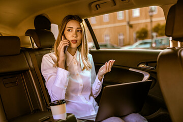 Young business woman in car
