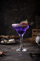Purple fig cocktail or mocktail in glass
