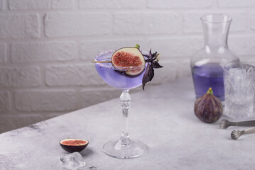 Purple fig cocktail or mocktail in glass