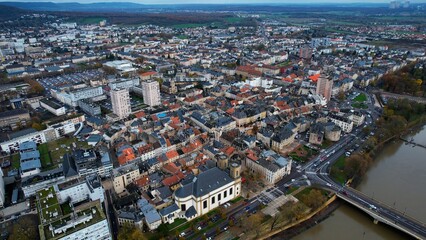 Fototapeta na wymiar Aerial around the city Thionville in France on a sunny noon in later fall.