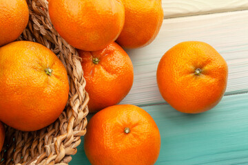 tangerine on wood background top view