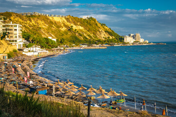 currilave beach shoreline with hotels in Durres, Albania during sunset
