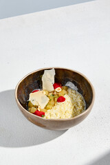 Millet porridge with stewed pear in a bowl, a warm and wholesome breakfast option
