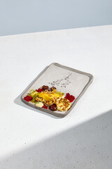 Syrniki with berries and mango mousse, a high-end culinary presentation in natural light