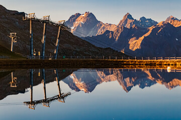 Beautiful alpine sunrise view with reflections in a lake at Mount Sechszeiger, Jerzens, Imst,...