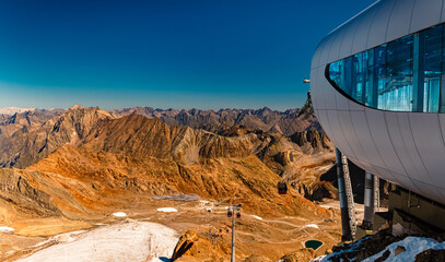 Alpine summer view with the highest café in Tyrol at Wildspitzbahn cable car, Pitztal Glacier,...