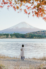 person on the lake with fuji mountain 