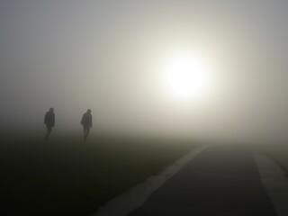 Obraz na płótnie Canvas human is walking in the foggy night