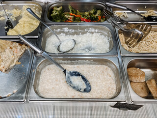 City canteen, counter with different cereals, buffet, breakfast to choose from.