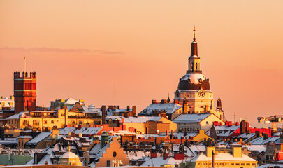 Katarina Church and the roof tops of the district of Södermalm, Stockholm, at sunset, clear sky,...