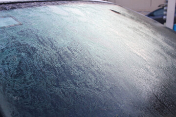 Frozen car windshield ice cold weather
