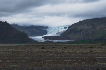 Scenic view of glacial landscape against sky