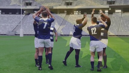 Animation of flag of bosnia and herzegovina over diverse male rugby players high fiving at stadium