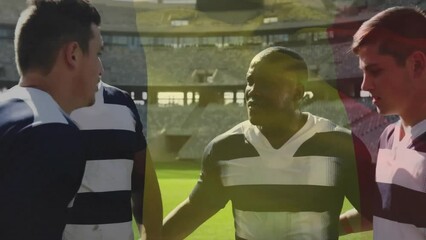 Animation of flag of belgium over diverse male rugby players talking at stadium - Powered by Adobe