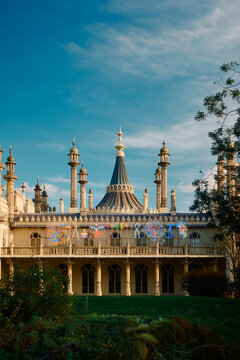 Brighton Pavilion building in seaside town at sunset with blue skies