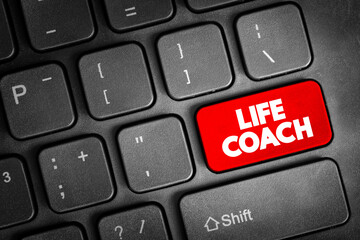 Life Coach - type of wellness professional who helps people make progress in their lives text button on keyboard, concept background