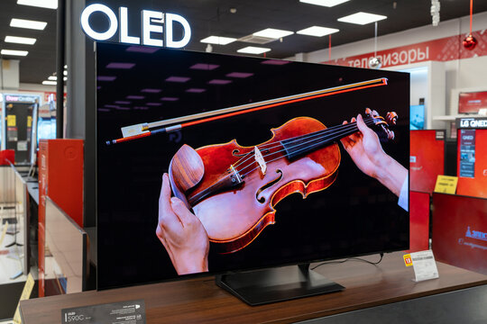 New Samsung OLED TV display inside electronics store. Minsk, Belarus - January 10, 2024