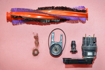 Repair clogged brush roll. Brushroll of vacuum cleaner loaded with hair and debris, clean brush...