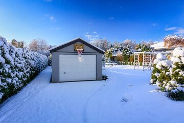 Driveway to house covered with snow and ice at winter. Poland