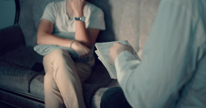 Psychiatrist Taking Notes During Session With Depressive man. Psychology.
