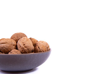 Walnuts are on a plate. Isolate. Ingredients. Diet and weight loss. Vitamins.
