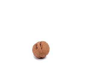 Scattered whole walnuts lie on a white background. Backgrounds and textures. Isolate.
