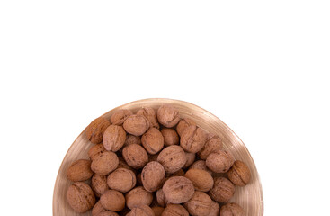 Walnuts are on a plate. Isolate. Ingredients. Diet and weight loss. Vitamins.