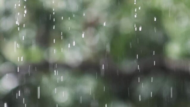 Rain falling from the roof in slow motion 4x. Climate change concept and increased rainfall.