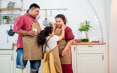 Portrait of three people asian family including happy father, husband with disable prosthetic leg,...