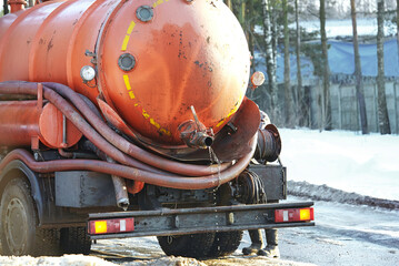 Sewer cleaning truck, sewage cleanup service. Truck with cistern and pump hose. Liquid drain...