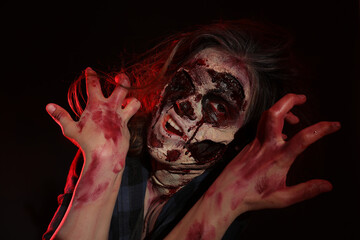 Scary zombie on dark background. Halloween monster