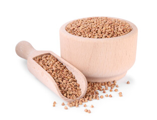 Raw buckwheat in bowl and scoop isolated on white