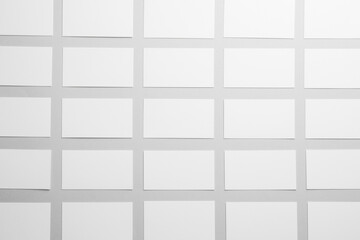 Blank business cards on light gray background, flat lay. Mockup for design