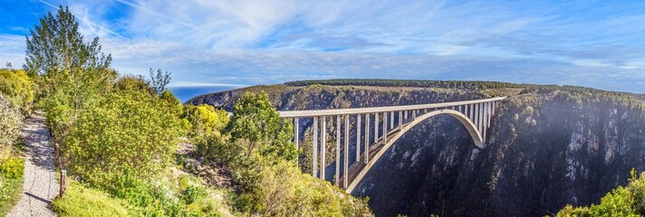 Panoramic picture of the Bloukrans Bridge in South Africa's Tsitsikama National Park - obrazy, fototapety, plakaty