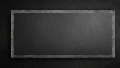 black on black empty black granite stone rectangle board on black textured cement background top view vith copy space for your text