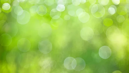 Tuinposter abstract circular green bokeh background green nature spring and nature light in blurred style copy space © Irene