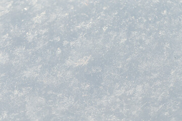 White snow texture macro. Winter background. Snowflakes