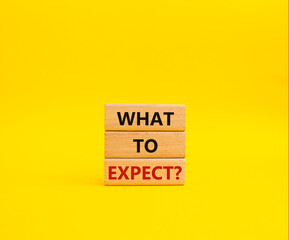What to Expect symbol. Concept words What to Expect on wooden blocks. Beautiful yellow background. Business and What to Expect concept. Copy space.