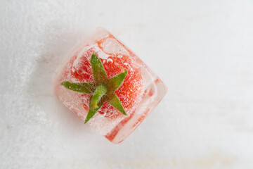 Photographic shot of some tomatoes inside ice cube