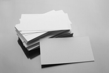Blank business cards on mirror surface. Mockup for design