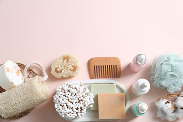 Fototapeta na wymiar Bath accessories. Flat lay composition with personal care products on pink background, space for text
