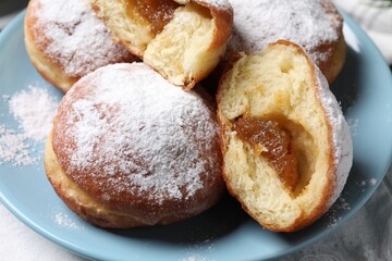 Delicious sweet buns with jam on table, closeup