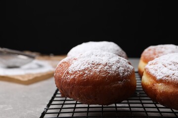 Delicious sweet buns on table against black background, closeup. Space for text